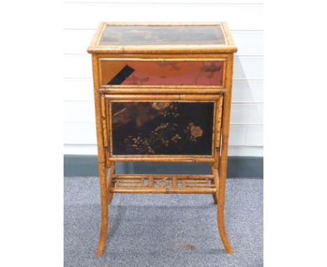 19th century bamboo and lacquer worktable with decoration of birds and flowers, having fold down shelf to front revealing com