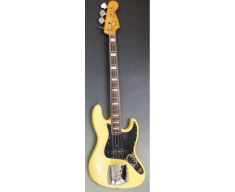 1976 Fender Jazz electric bass guitar, made in the USA, serial no. 7631431, finished in ivory lacquer, with original owner's 