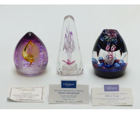 Three Caithness limited edition glass paperweights, Winter Wonderland, Mirror Image and the other, tallest 13cm with certific