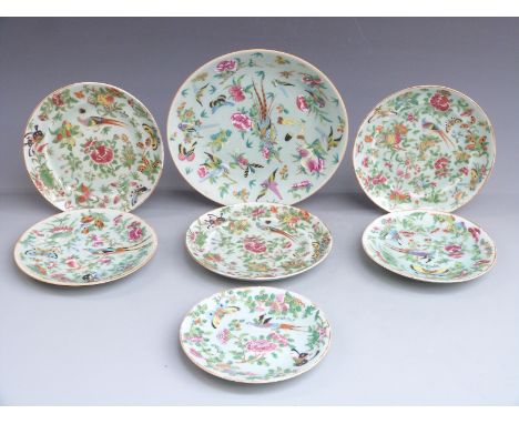 Seven Chinese Canton famille rose plates each decorated with birds, butterflies and flowers, largest 26cm in diameter.&nbsp;