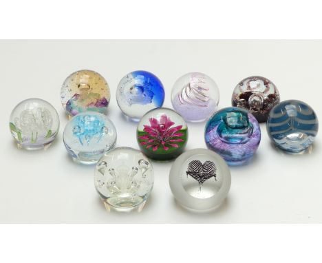 Eleven Caithness limited edition glass paperweights, all with certificate of authenticity