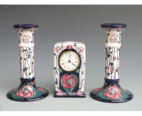 Moorcroft clock and candlestick garniture in the Mackintosh pattern, tallest 21cm&nbsp;