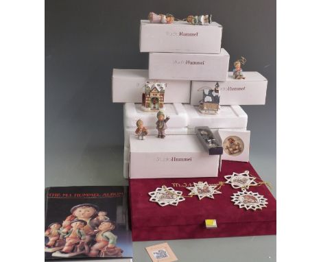 Goebel Hummel Christmas tree decorations in fitted case; M.I. Hummel album and approximately 18 Goebel Studio Hummels