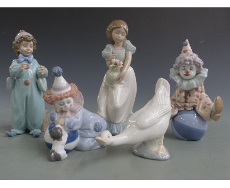 Five Lladro/Nao figures including three Lladro child clowns, tallest 22cm