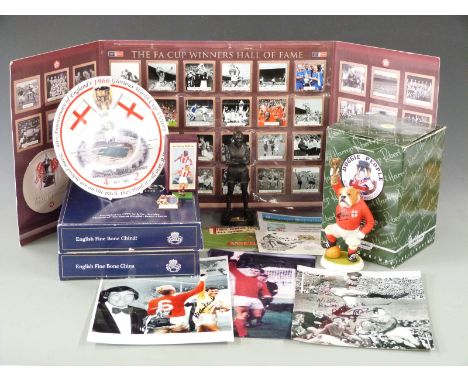 A collection of football memorabilia and autographs including a Gordon Banks signed photo, Geoff Hurst signed first day cover