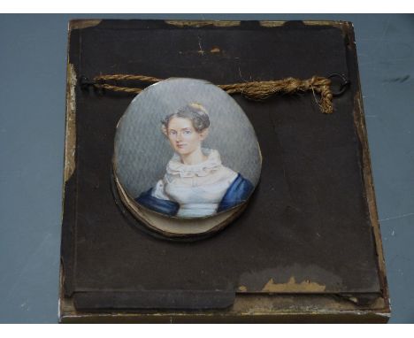 A 19th century portrait miniature on ivory of a lady with a lace collar inscribed verso Mrs C.Duncan, taken in Kingston Jamai