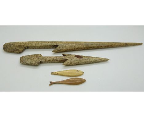 19thC Inuit bone harpoon and spear head together with two carved fish, probably jigging lures, largest item 30cm