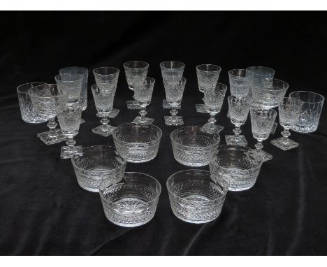 A suite of Edinburgh Crystal glasses comprising eight sherry glasses, six white wine glasses, two pink champagne glasses, two