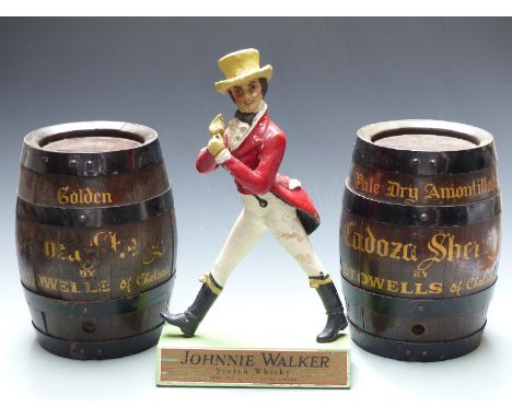 Two vintage bar top Cadoza sherry barrels, height 28cm together with a Johnnie Walker Scotish Whisky advertising figure, heig
