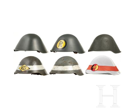 Sechs Stahlhelme M 56, 1950er - 1980er Jahre  Stahlhelm M 56/1, feldgrau lackiert (berieben), links schwache Reste eines Helm