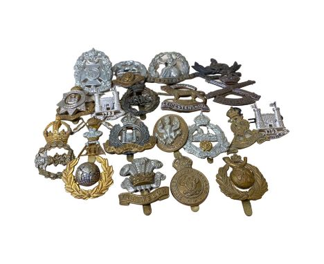 Quantity of 21 20th century British cap badges with Kings cross, varying regiments and dates to include: Canadian Machine Gun