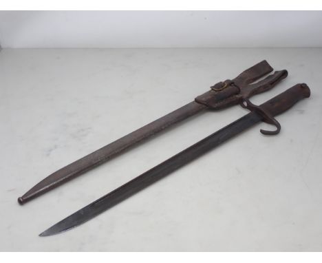 A Japanese type 30 Arisaka Bayonet is steel scabbard with leather frog 21in L overall 