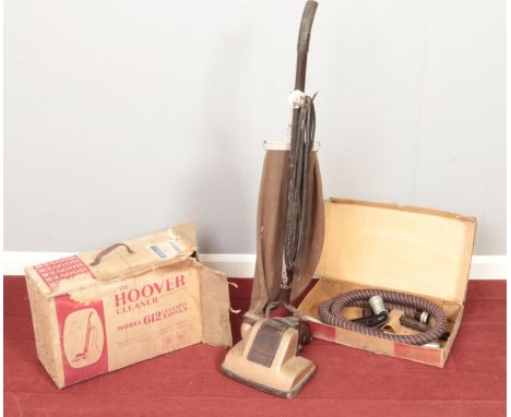 A vintage Hoover Junior. With boxed accessories.  