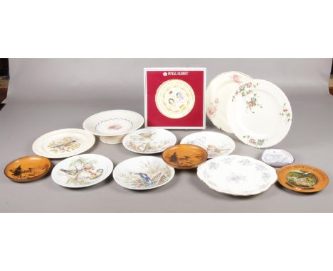 A box of named ceramic plates. To include four Royal Worcester bird plates, a boxed Royal Albert Golden Jubilee plate, and a 