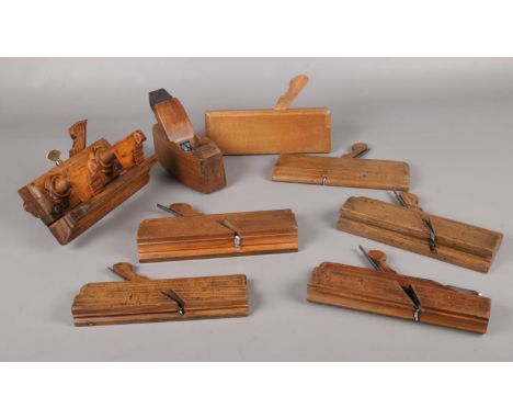 A box of vintage wood planes.  