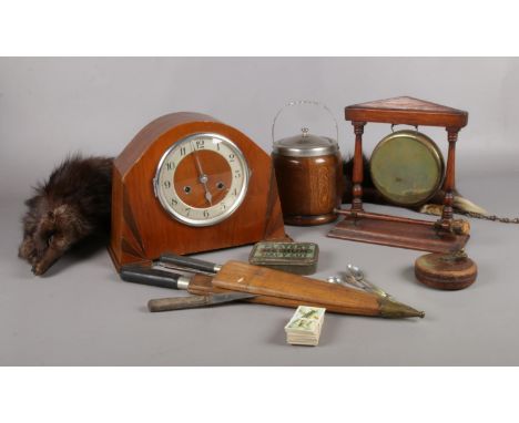A collection of miscellaneous. Mahogany mantle clock, mink fur stole with bag, vintage tape measure, gong etc.  