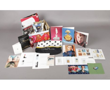A large quantity of perfume miniatures and samples 300+, a boxed un opened Femme Rochas 13ml and an original Carolina Herrera