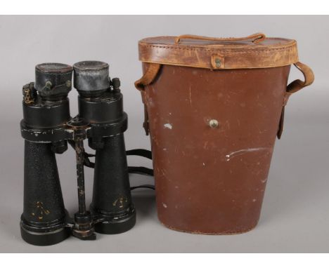 A cased pair of WWII Barr &amp; Stroud CF41 Binoculars. 7x Zoom, A.P No. 1900A, Serial No. 50237. Yellow arrow to base of bin