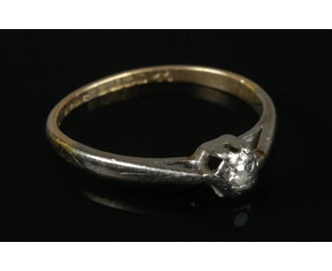 An 18ct Gold and single diamond (1/16 ct) ring. Size K½. Total weight: 1.74g  