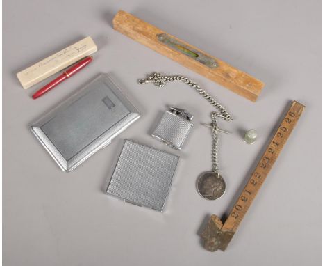 A box of collectables. Including Victorian crown on albo silver albert chain, cigarette cases, lighter, fountain pen, etc.  
