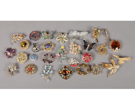 A box containing thirty one vintage costume jewellery brooches.  Star and bird both missing some stones.