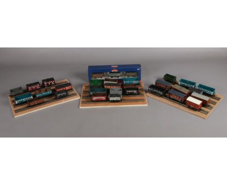 A collection of assorted 00 gauge wagons and rolling stock. To include Hornby &amp; a boxed Bachmann set of three Northern pr