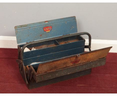 A vintage metal tool box with various hand tools.  