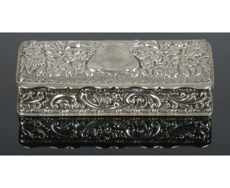 A silver trinket box, with floral decoration. Engraved with 'G.B' on cartouche. Assayed for Birmingham, 1904, by George Natha
