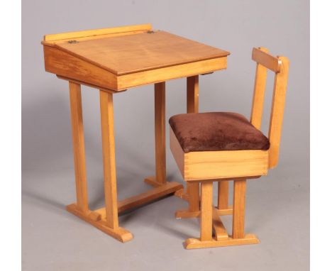 A vintage children's school desk and chair. Both with storage compartments.  