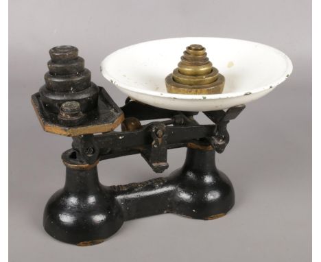 A set of vintage cast iron scales. With enamel dish and weights.  