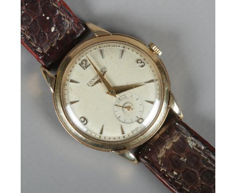 A gents 9ct gold Longines manual wristwatch on leather strap. Presentation inscription to back.  Running.