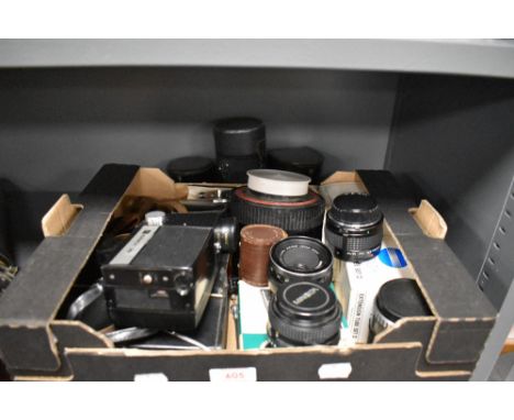 A box of photographic and film items including a Rank Aldis cine camera, a Carl Zeiss 135mm and 50mm lens, RMC Tokina doubler