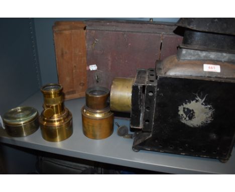 A magic lantern in wooden box with brass lenses (one lens cracked)