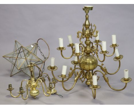 A Dutch-style brass-finish twelve-branch electrolier, 77cm wide x 64cm high; together with two other ceiling light fittings.