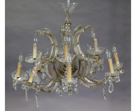 A 20th century Venetian glass 8-branch light fitting of two concentric tiers, of rococo design hung with cascading prism drop