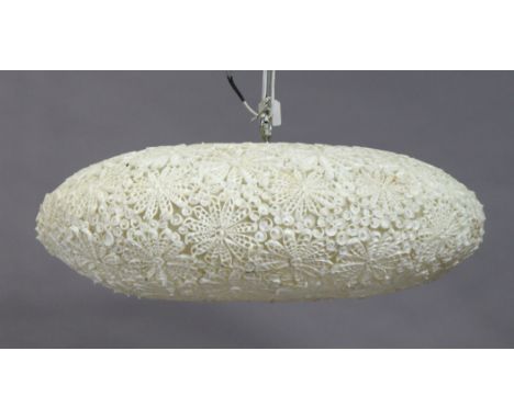 A white-finish ceiling light fitting with all-over simulated sea-shell decoration, 67cm diameter.