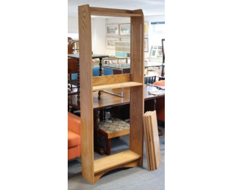 A light oak tall standing open bookcase with an arrangement of seven fixed &amp; adjustable shelves, 75cm wide x 197cm high x