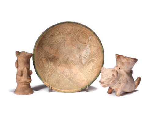 A Persian sgraffito pottery bowl decorated a central flowerhead and a scale ground with five rondals depicting a hare, two ti