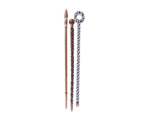 A Zulu 'pipe' stick South Africa the hollowed finial, pierced at the base for a mouthpiece, the shaft with three snakes entwi