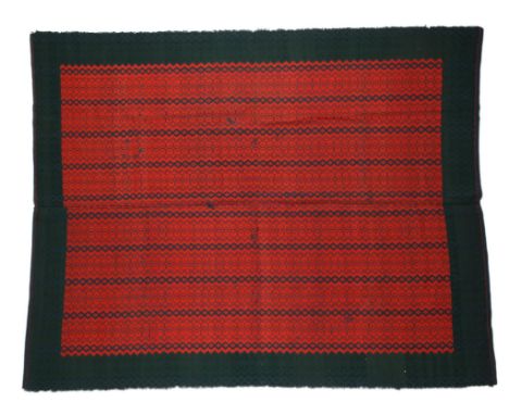 A Swedish embroidered panel in two parts worked geometric designs in blue, green and red, 18th century, 174cm x 141cm.