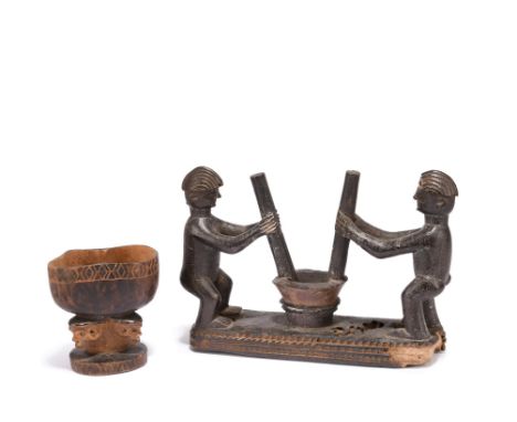 A Pende offering cup Democratic Republic of the Congo carved with pokerwork detailing, the stem with two heads and a ring fin