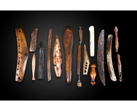 λA collection of Inuit implements Alaska walrus ivory and antler, including, a bag handle inscribed 1771 JH A.S, two needle c