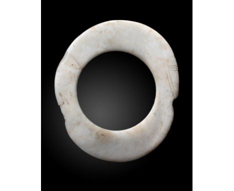 A Boiken currency ring Papua New Guinea clam shell, with incised linear decoration, 23.5cm x 26.6cm. Provenance Oliver Hoare,