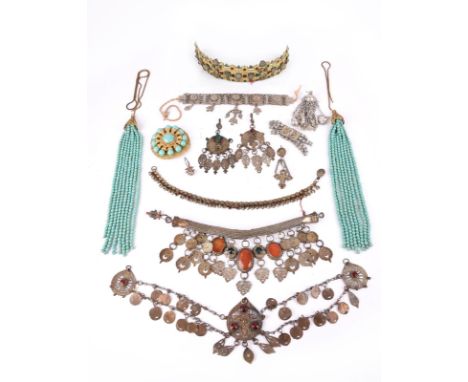 A collection of Berber jewellery Morocco including a gilt brass headdress with applied florets and inset cut glass beads, wit