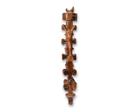 A Congo crucifix sceptre with a trefoil platform finial above relief carved figures of Christ and the Virgin Mother, lobed si