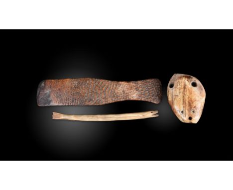 λAn Inuit handle / scraper Alaska walrus ivory, with a textured surface, the back with the remains of a white painted invento