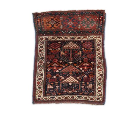 A Qashqai bag face 20th century the main panel with a stylised figure with three medallions above, 78cm x 58cm. Provenance Ph