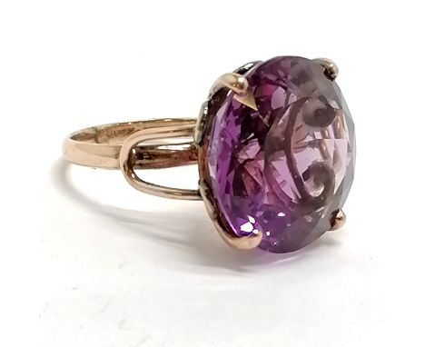 Unmarked rose gold large amethyst stone set ring - size L½ &amp; 6.4g total weight ~ stone approx 17mm diameter - has a small