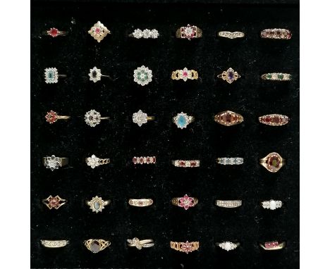 Pad of 36 x 9ct gold stone set rings inc opal, ruby, emerald, diamond, garnet etc - total weight (lot) 87g ~ ring #19 has 2 s