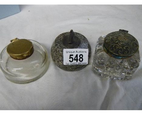 Two glass inkwells and an inkwell in the form of a curling stone.